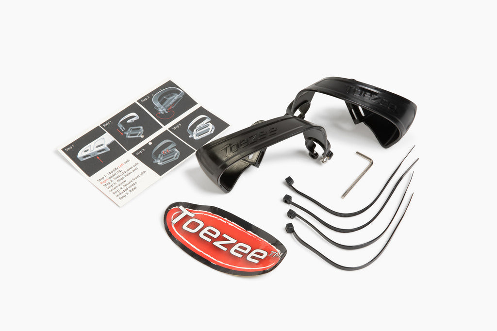 Toezee™ pedal clip package contents including clips and installation parts, ready to fit most standard pedals.