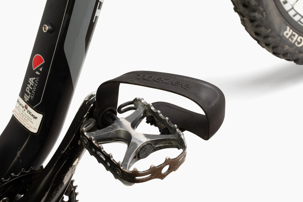 Toezee pedal clip installed on a city bike pedal