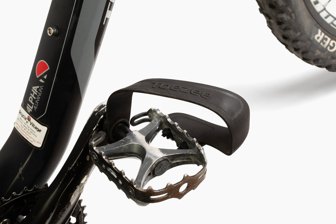 Toezee pedal clip installed on a city bike pedal